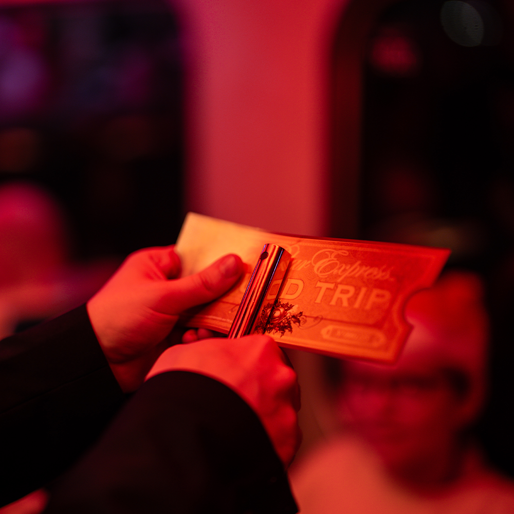 close up of tickets being clipped on board the polar express train ride