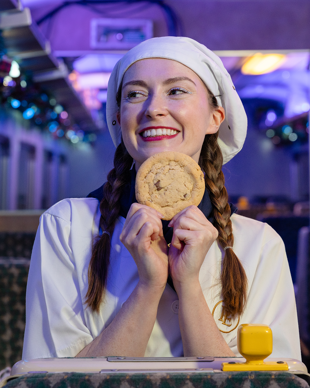 chef with cookie on board the polar express train ride