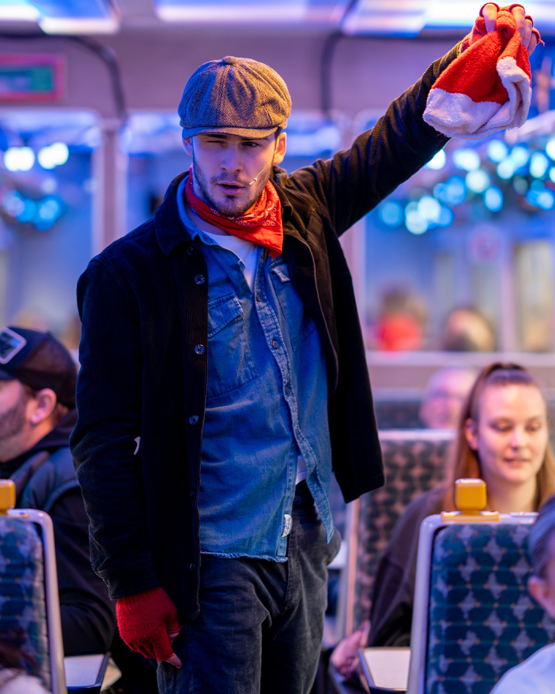 hobo holding santa hat on board the polar express train ride