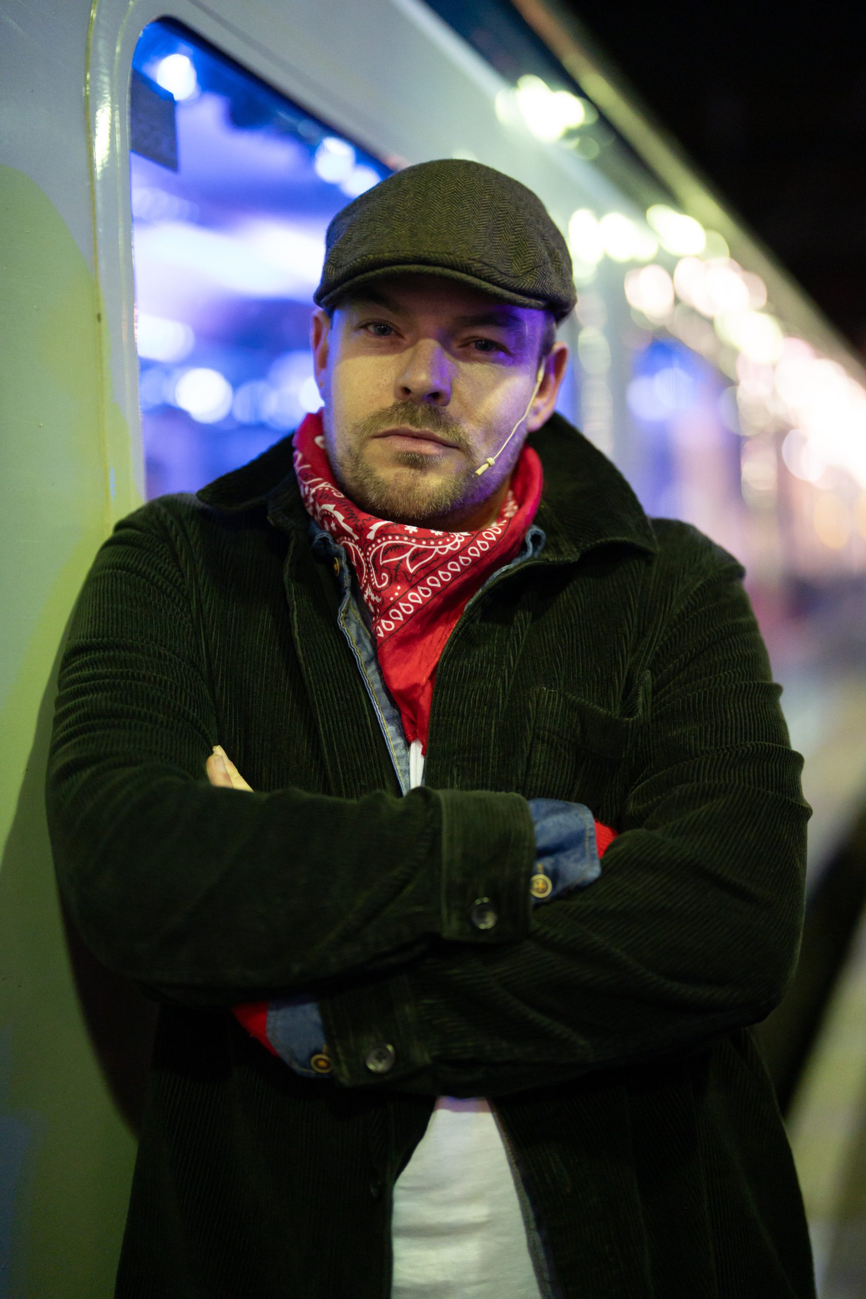 hobo with arms crossed posing in front of the polar express train ride