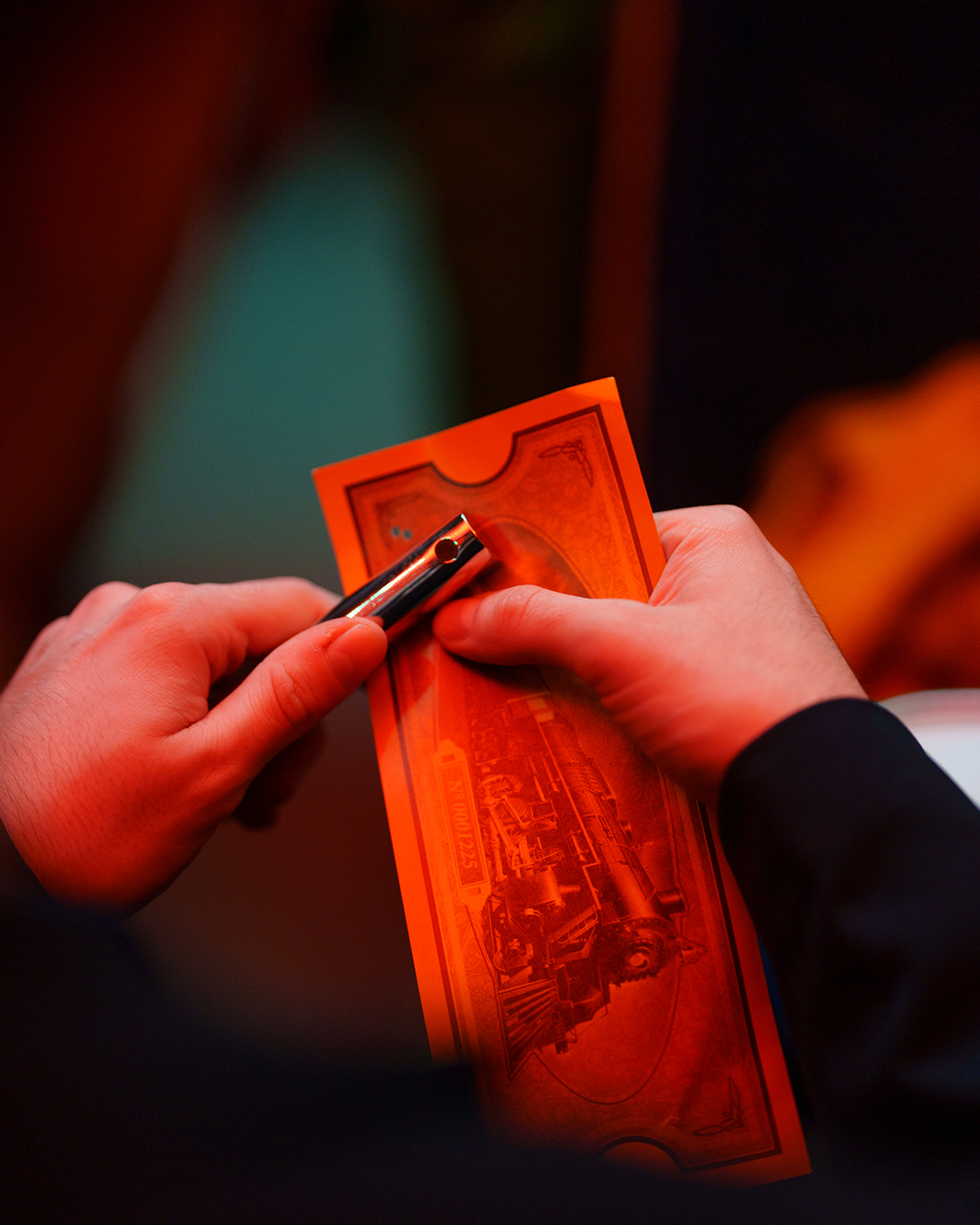 ticket being clipped on board the polar express train ride
