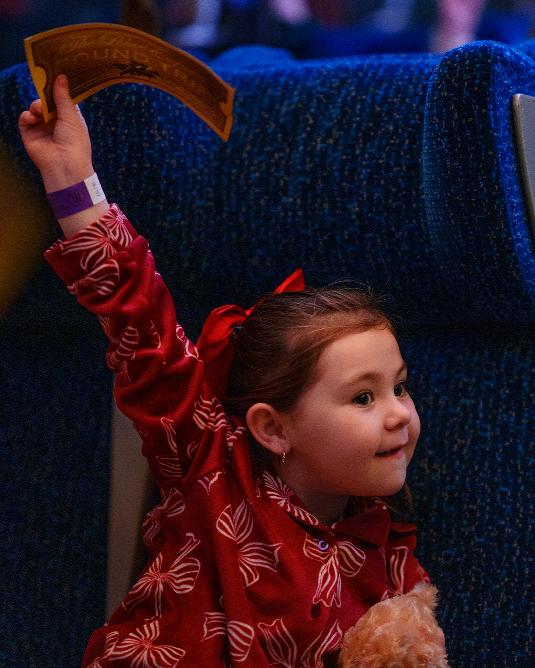 child with golden ticket at the polar express train ride